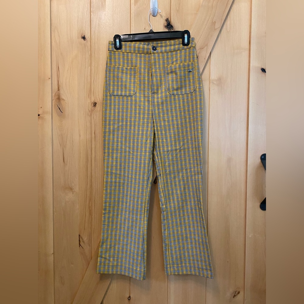 Tartan pants. Light flare at bottom. Plaid trousers